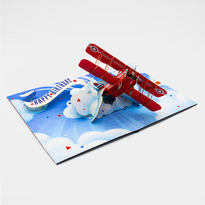 3D Pop-Up Karte mit rotem Flugzeug ohne Briefumschlag, liebevoll gestaltet und detailreich verarbeitet.